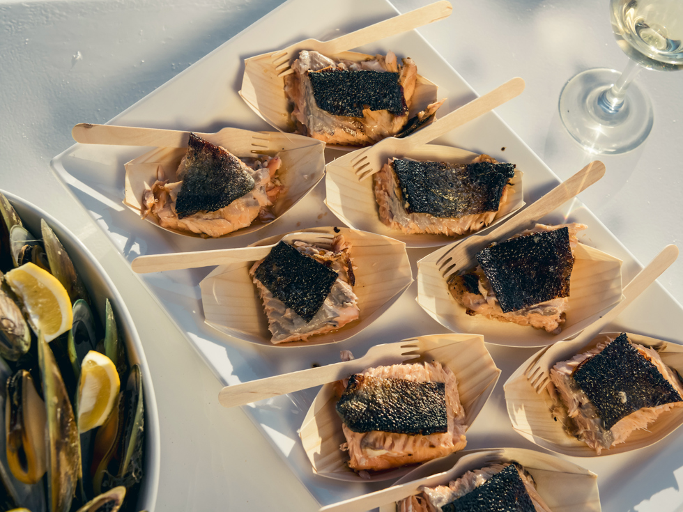 Delicious fresh salmon and mussels are served aboard Marlborough Tour Company's Seafood Odyssea cruise from Picton in New Zealand's Marlborough Sounds.