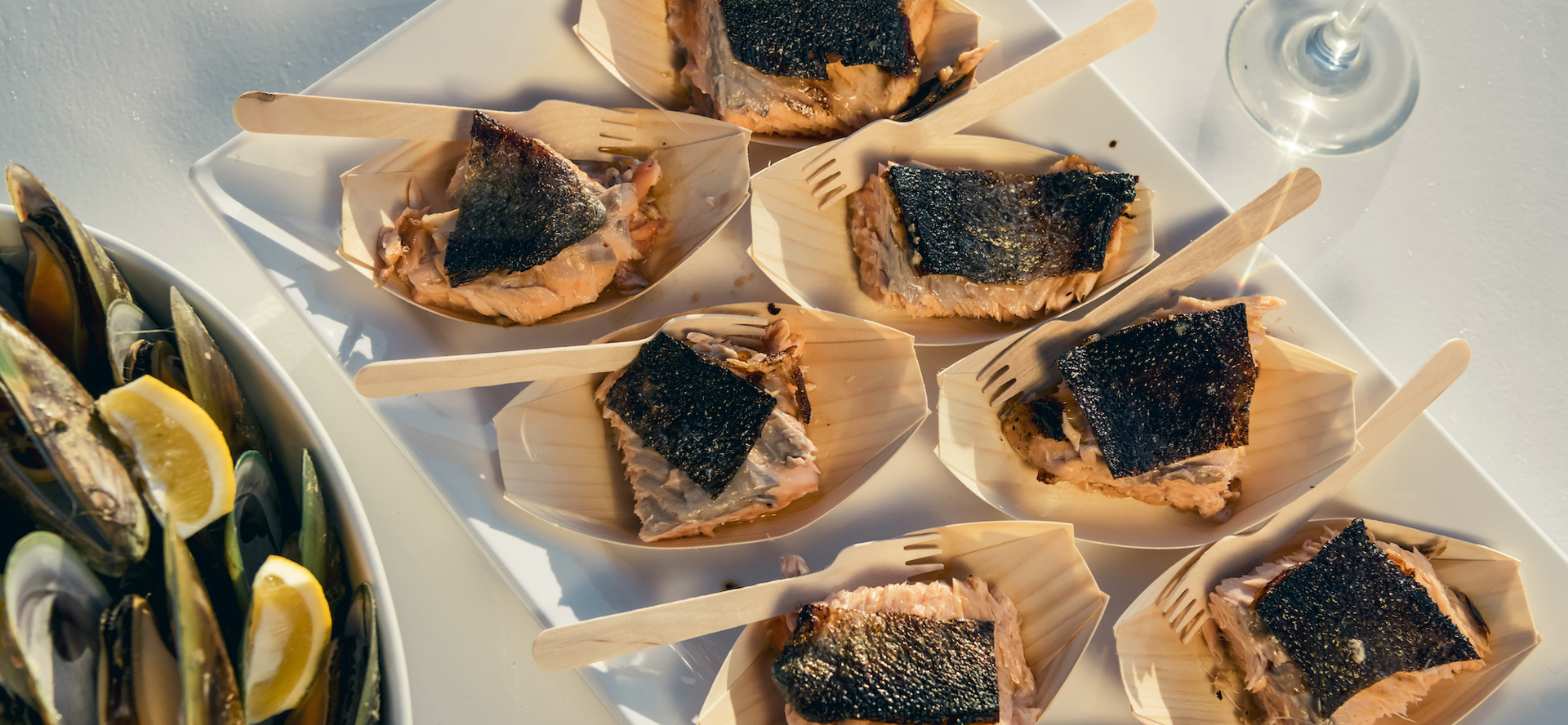 Delicious fresh salmon and mussels are served aboard Marlborough Tour Company's Seafood Odyssea cruise from Picton in New Zealand's Marlborough Sounds.