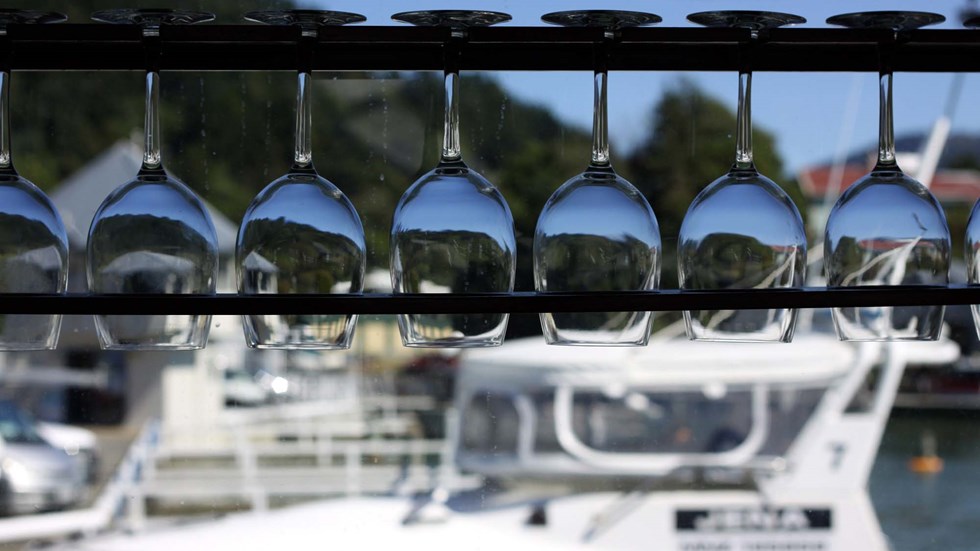 Glasses hanging in the bar onboard one of our boats in the Marlborough Sounds, at the top of New Zealand's South Island