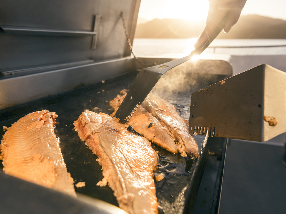 Marlborough salmon being BBQ'd onboard a Marlborough Tour Co boat in the Marlborough Sounds top of New Zealand's South Island
