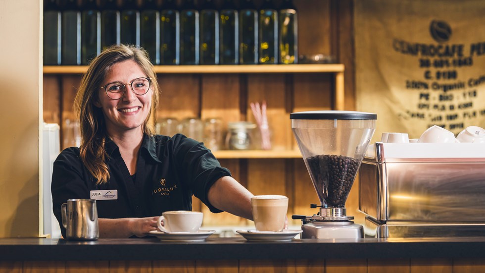 A barista makes coffee at the Furneaux Lodge Restaurant in the Marlborough Sounds at the top of New Zealand's South Island.
