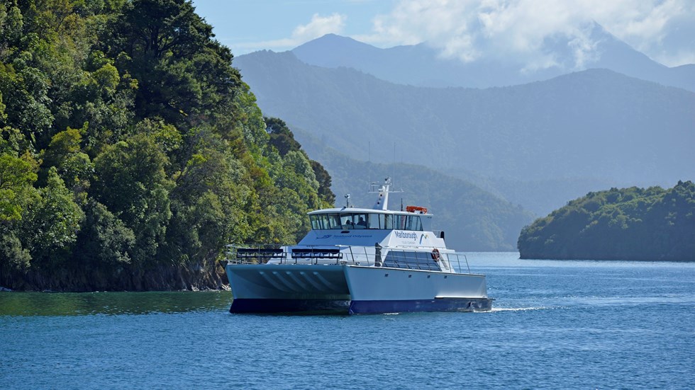 Marlborough Tour Company vessel MV Odyssea cruises towards Picton in New Zealand's Marlborough Sounds.