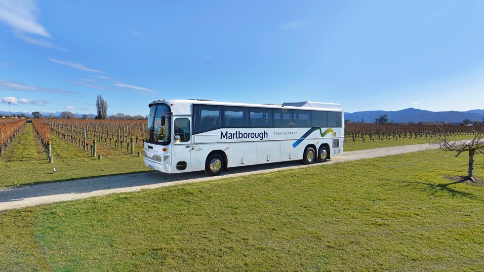A Marlborough Tour Company coach parked in a vineyard in Blenheim, Marlborough at the top of New Zealand's South Island.