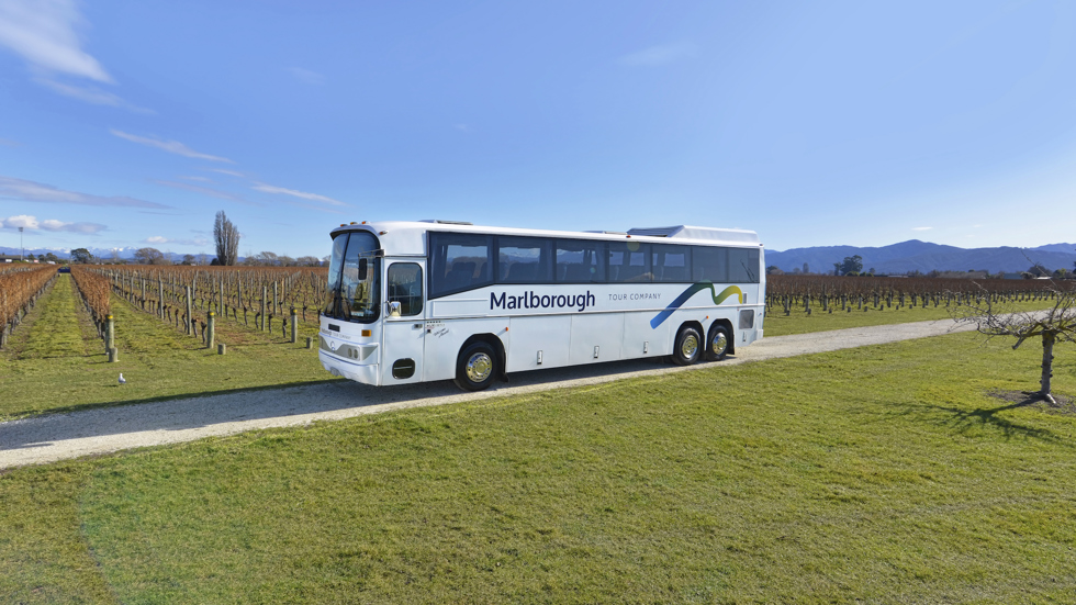 A Marlborough Tour Company coach parked in a vineyard in Blenheim, Marlborough at the top of New Zealand's South Island.