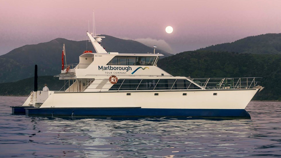 Marlborough Tour Company's MV Odyssea at sunset in New Zealand's Marlborough Sounds from Picton.