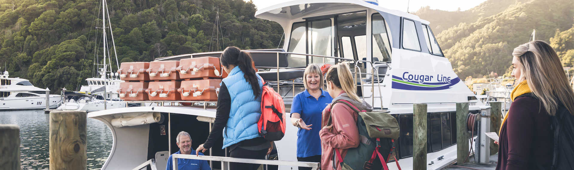 Cougar Line passengers board their boat in Picton Marina in the Marlborough Sounds, New Zealand.